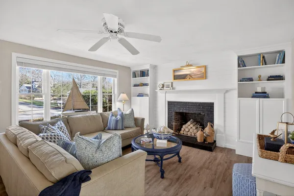 a living room with furniture and a fireplace