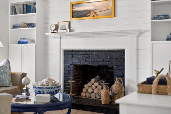 a living room with furniture and a fireplace