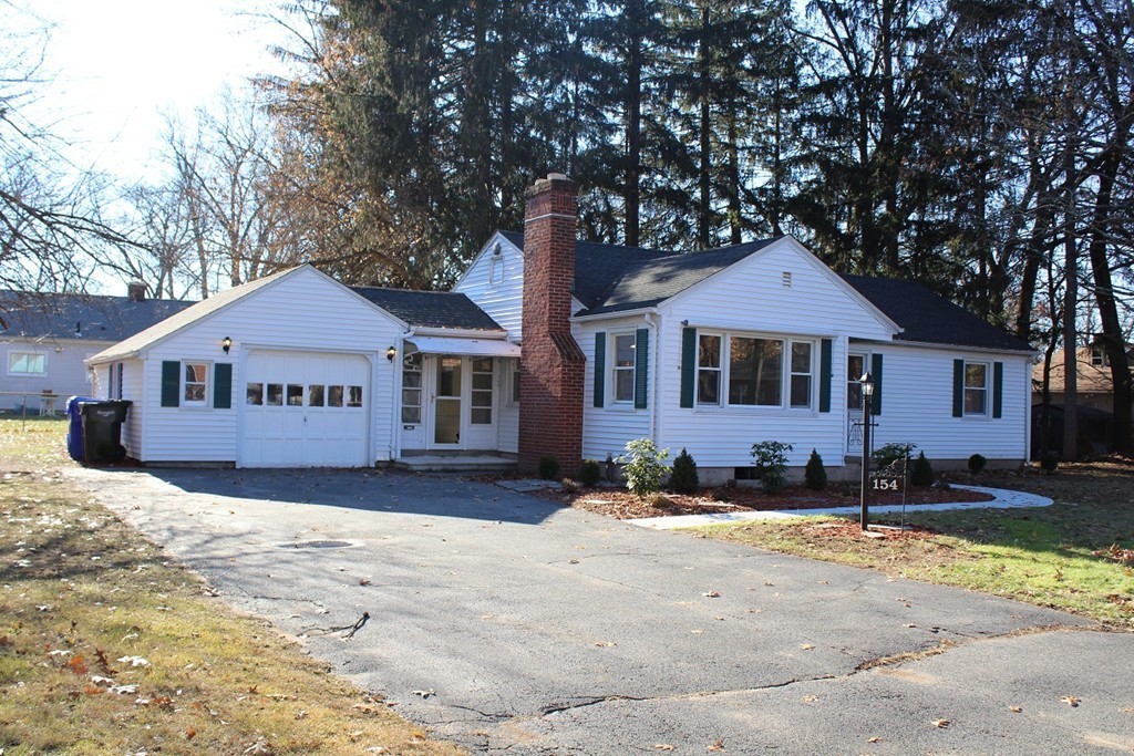 154 Carnavon Circle Springfield, MA 01109 - Photo 17 of 17 a front view of a house with a yard