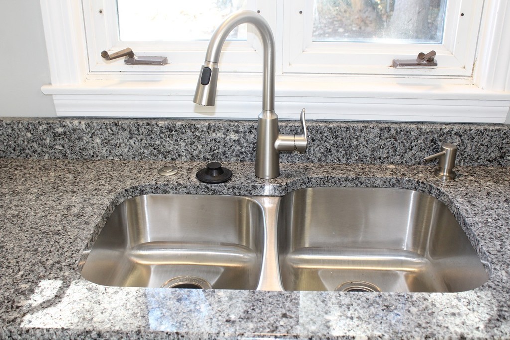 154 Carnavon Circle Springfield, MA 01109 - Photo 4 of 17 a close view of a faucet a sink and a stove