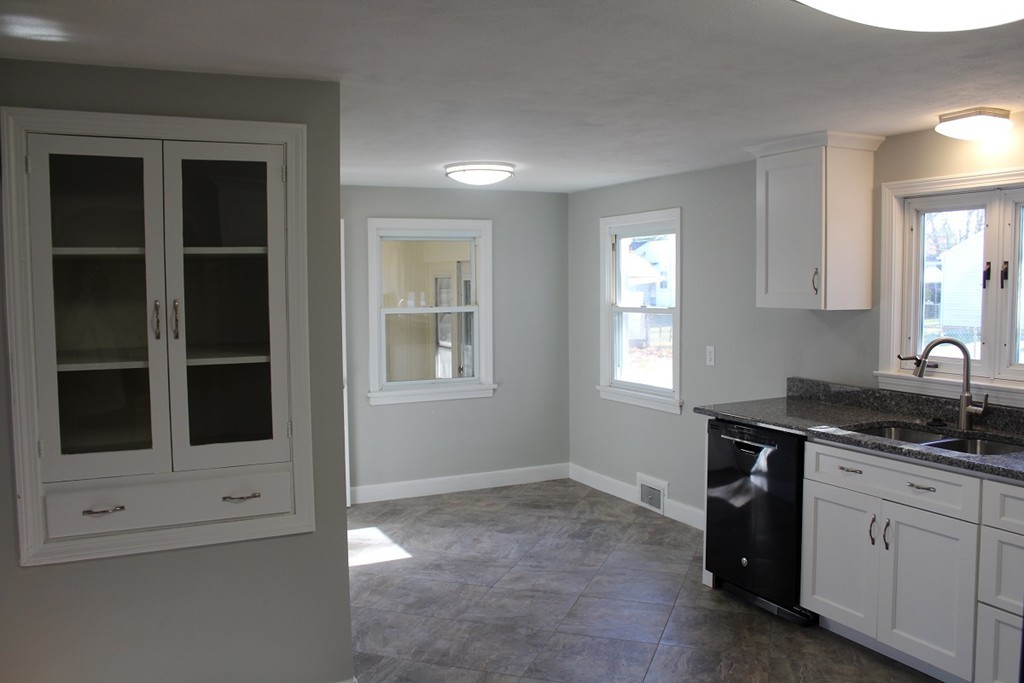 154 Carnavon Circle Springfield, MA 01109 - Photo 6 of 17 a kitchen with a sink and cabinets