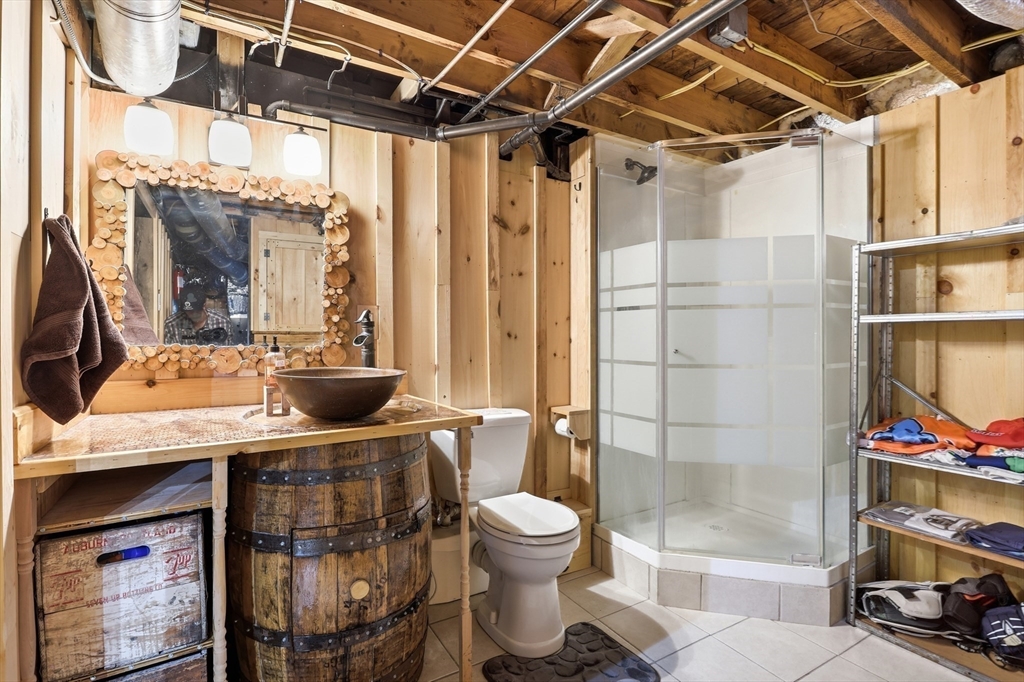2 Cashman Road Peabody, MA 01960 - Photo 21 of 37 a bathroom with a sink a toilet and shower