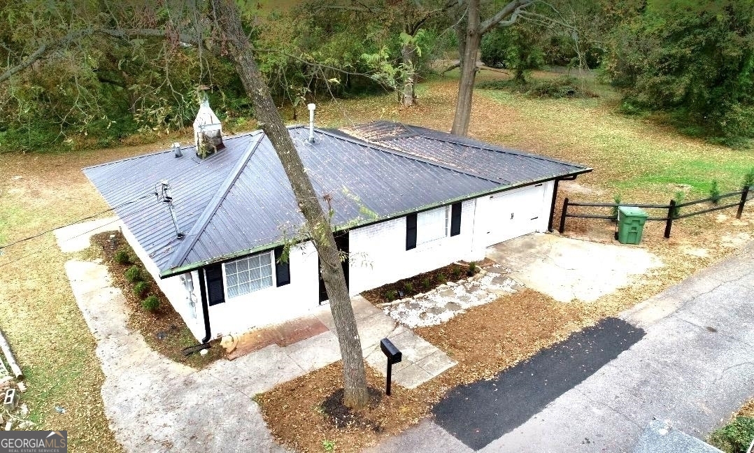 a aerial view of a house with table and chairs