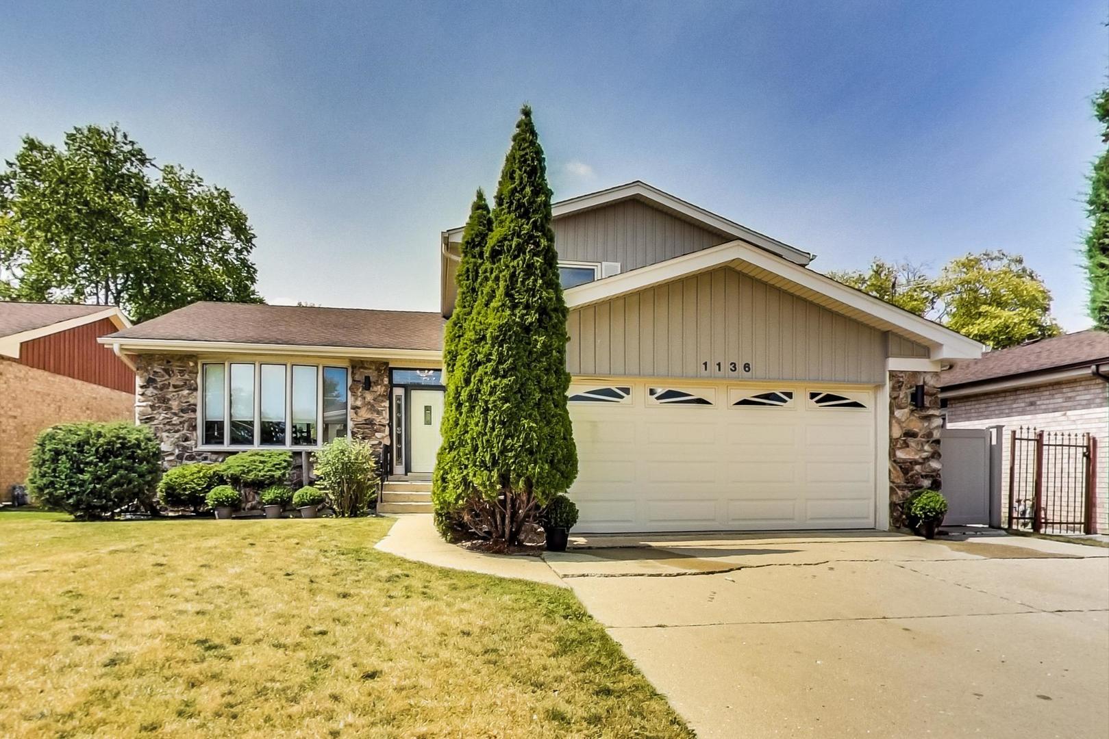 1136 North Greenwood Avenue Park Ridge, IL 60068 - Photo 1 of 30 a front view of house with yard and trees around