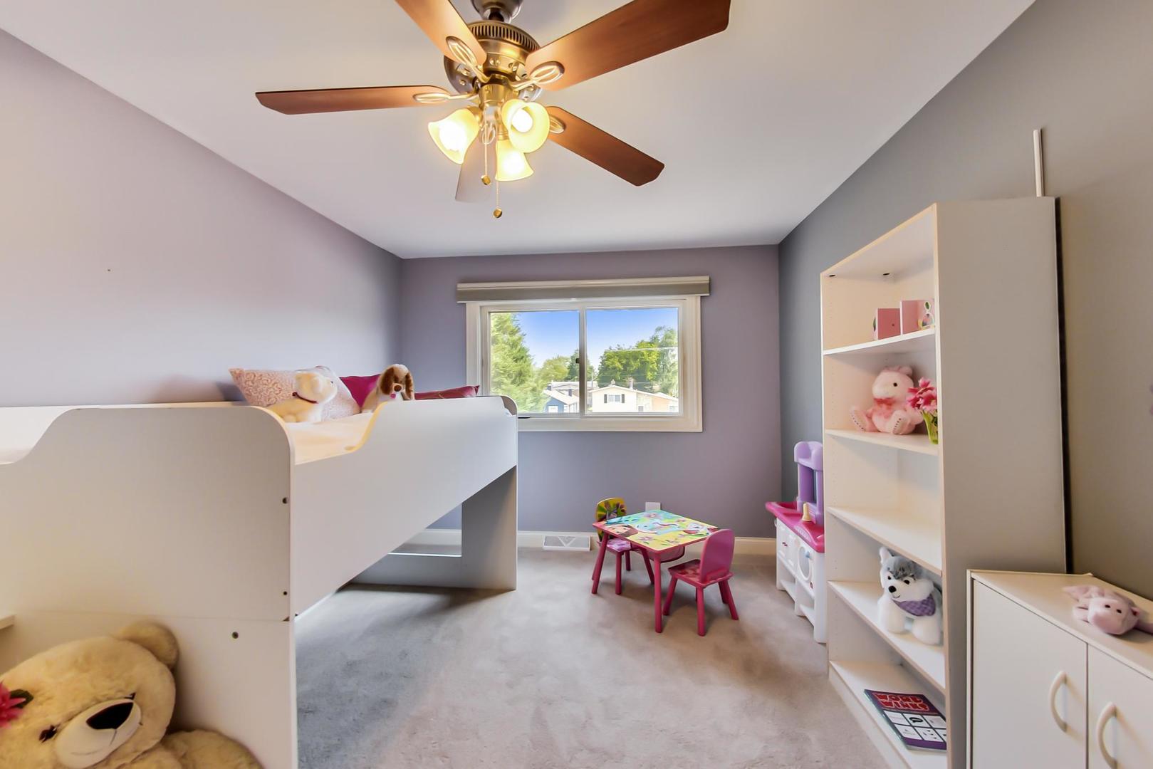 1136 North Greenwood Avenue Park Ridge, IL 60068 - Photo 19 of 30 a bedroom with a bed and a window