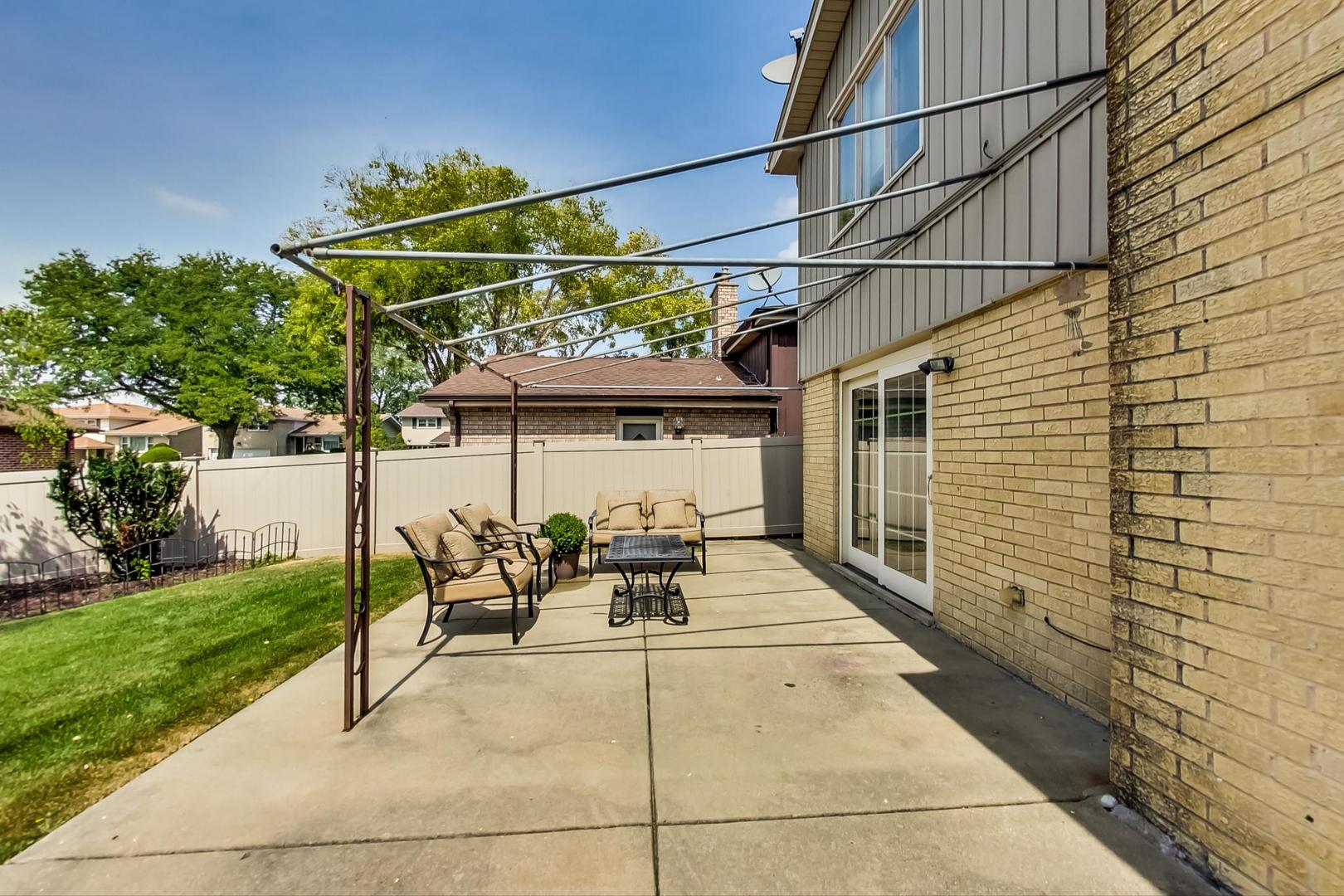 1136 North Greenwood Avenue Park Ridge, IL 60068 - Photo 25 of 30 a view of a patio with table and chairs and potted plants