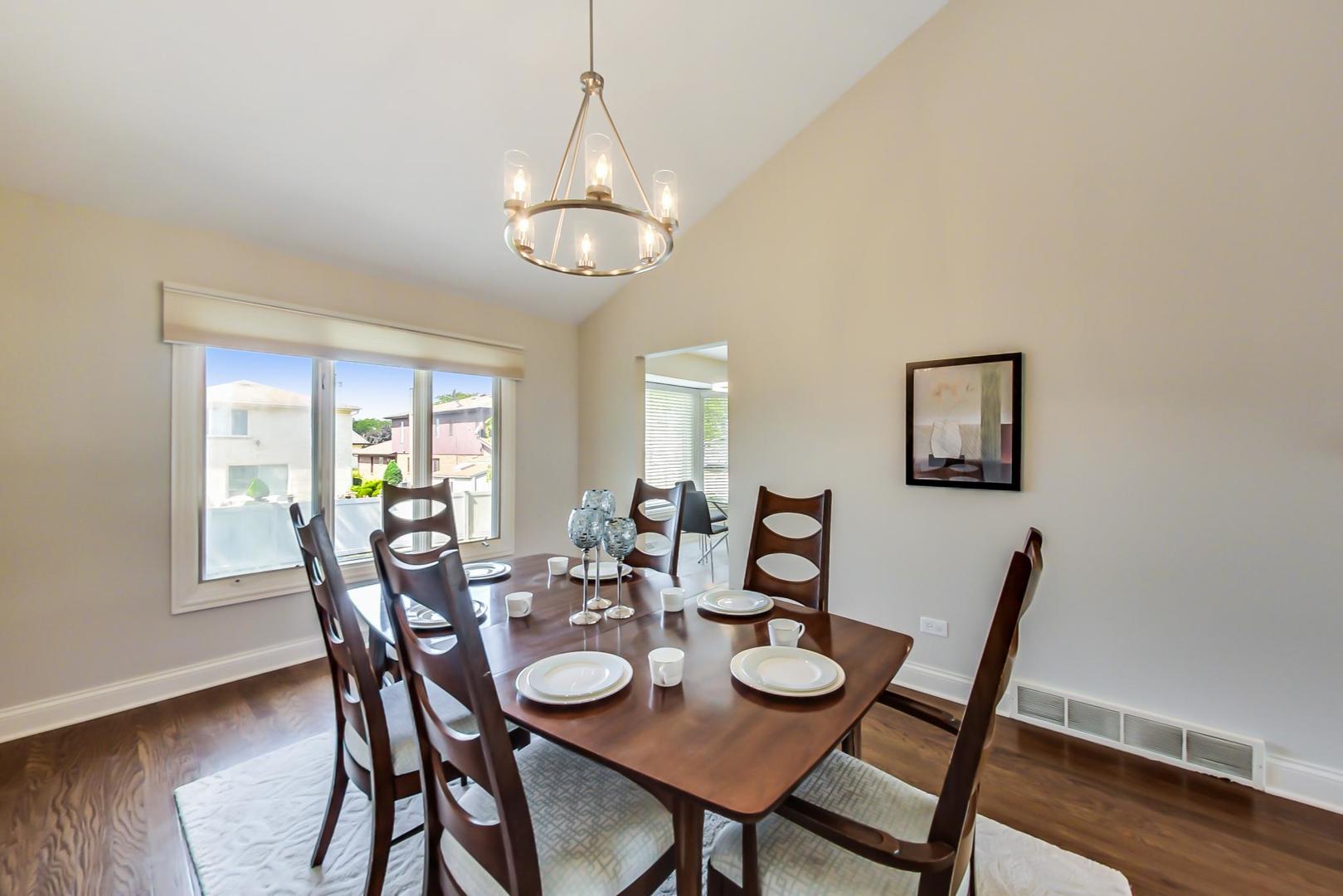 1136 North Greenwood Avenue Park Ridge, IL 60068 - Photo 5 of 30 a view of a dining room with furniture wooden floor and chandelier