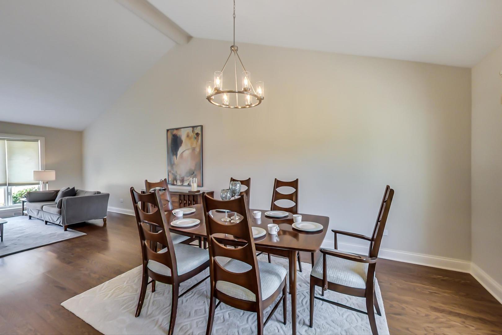 1136 North Greenwood Avenue Park Ridge, IL 60068 - Photo 7 of 30 a view of a dining room with furniture wooden floor and chandelier