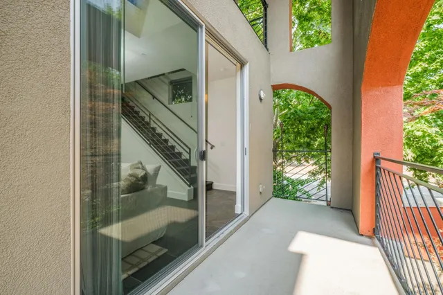 a view of balcony with wooden floor