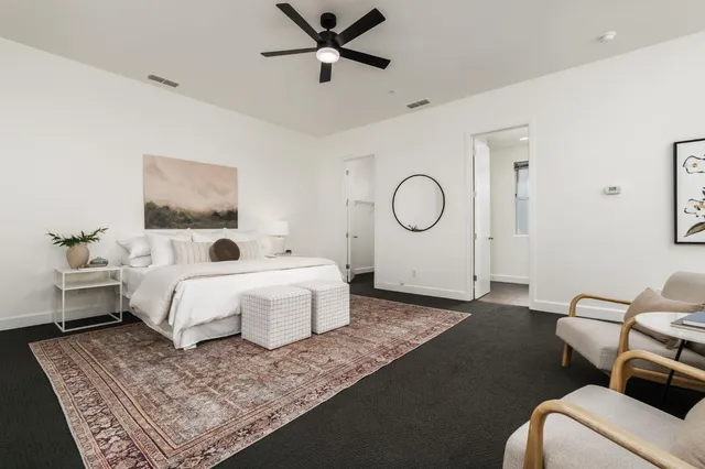 a bed room with a bed window and a couch