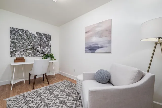 a living room with furniture and a table