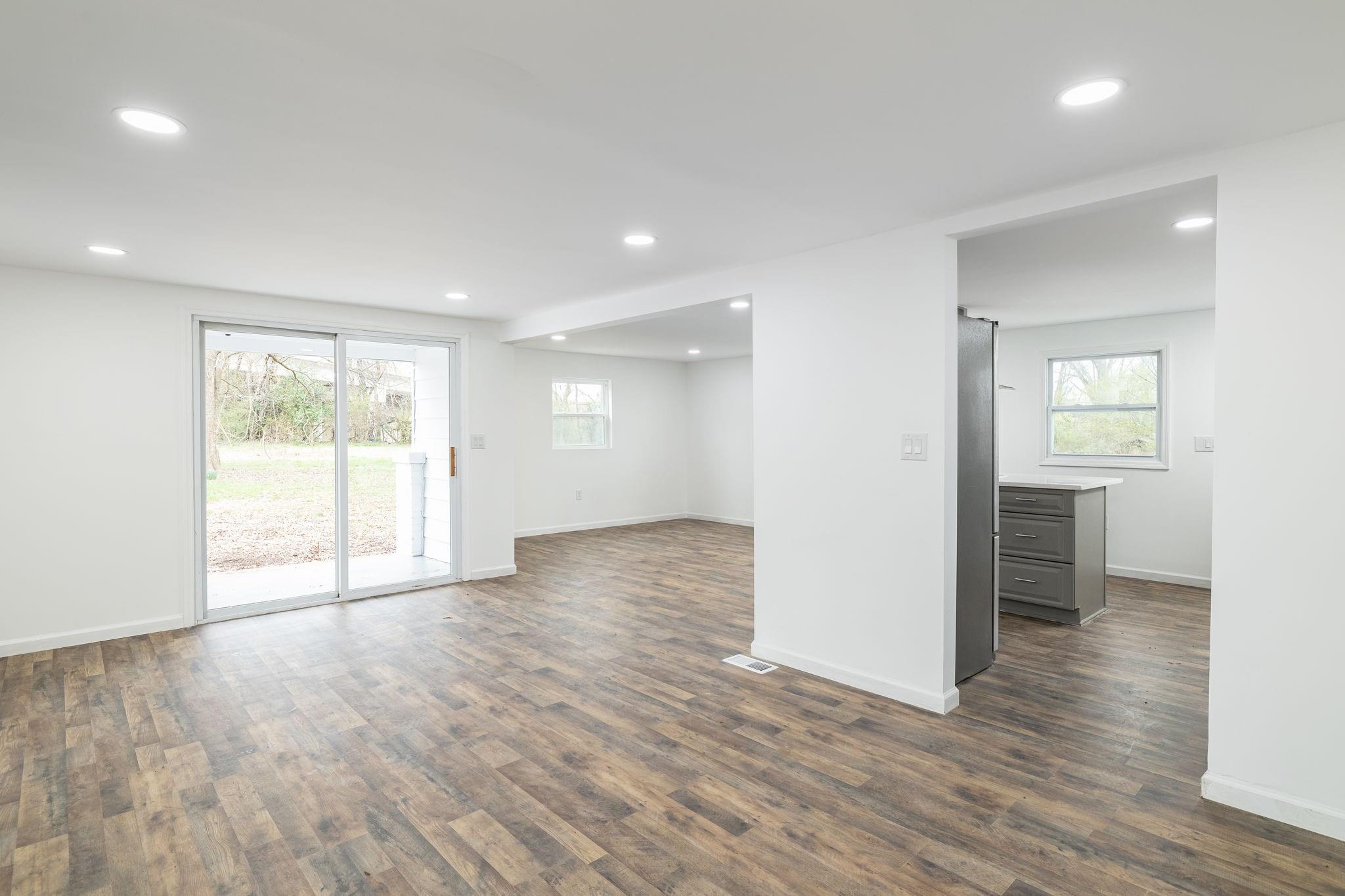 245 Madison Road China Grove, NC 28023 - Photo 5 of 18 a view of an empty room with wooden floor and a window