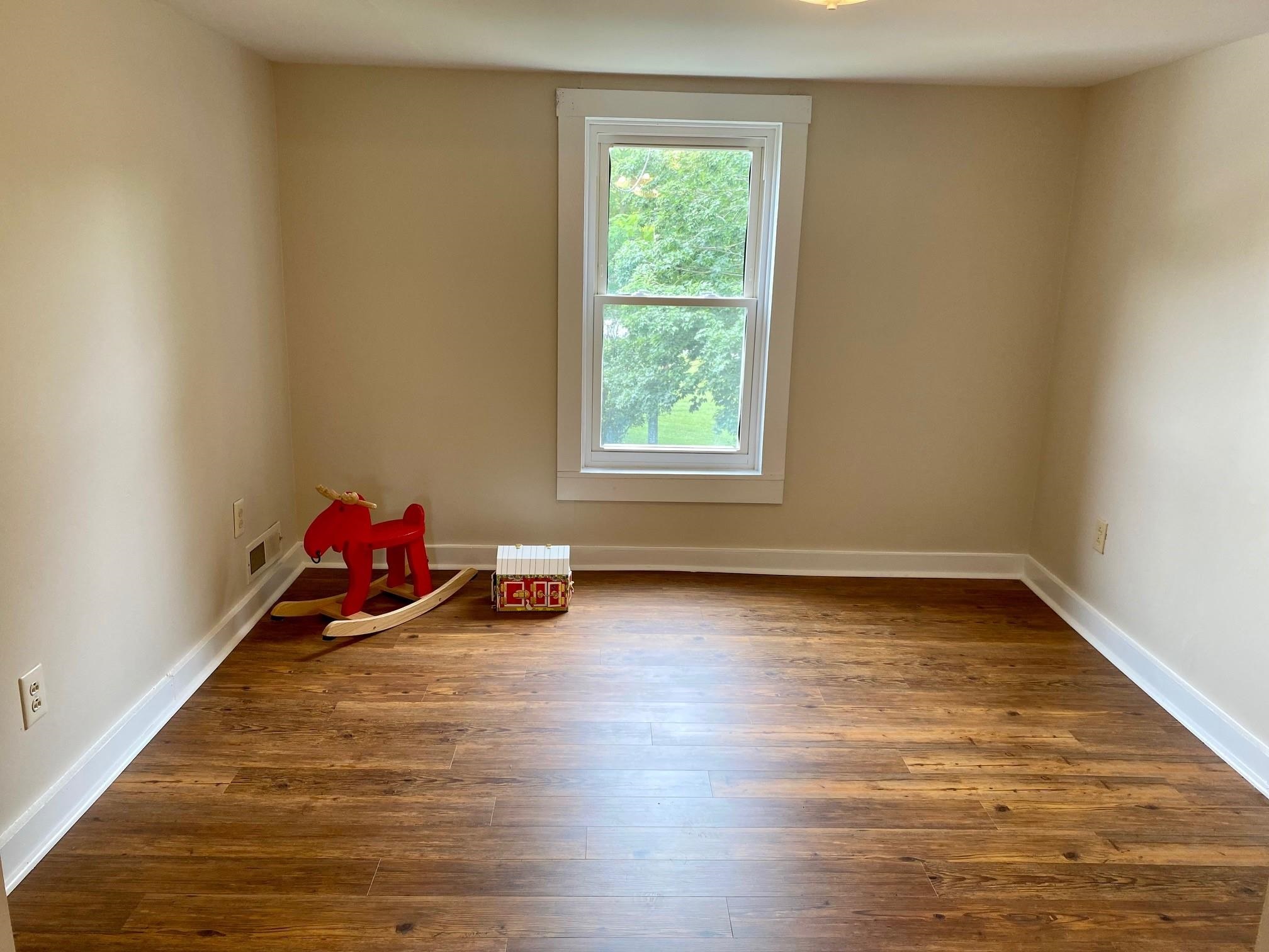 7524 Briery Branch Road Dayton, VA 22821 - Photo 22 of 28 a view of a room with wooden floor and a window