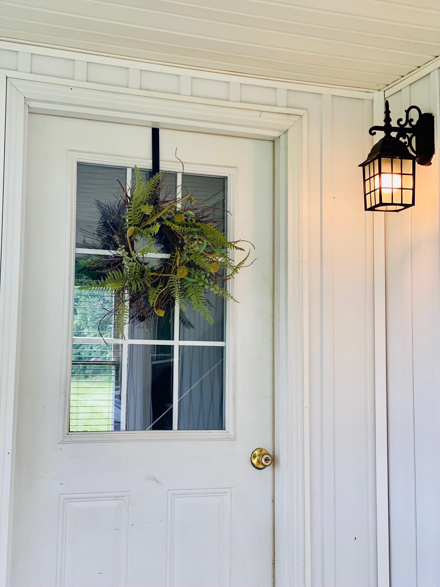 7524 Briery Branch Road Dayton, VA 22821 - Photo 4 of 28 a front view of a house with a potted plant