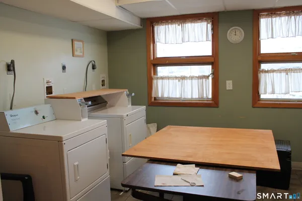 a room with a bed and a window