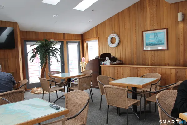 a view of a dining room with furniture and window