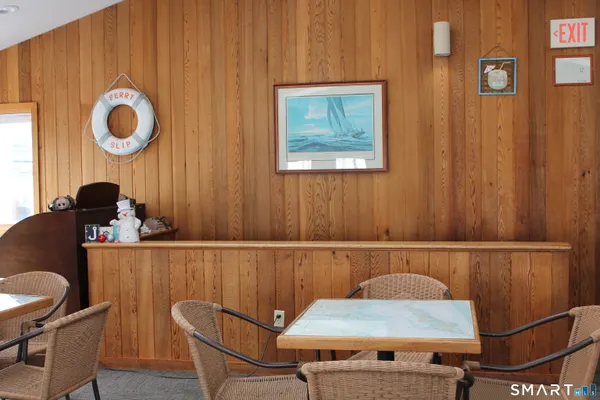 a kitchen with white cabinets and sink