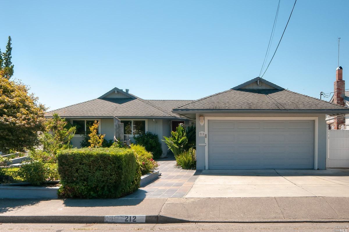 212 Montego Key Novato, CA 94949 - Photo 1 of 1 a front view of a house with garden