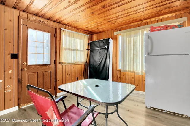 a balcony with furniture and wooden floor