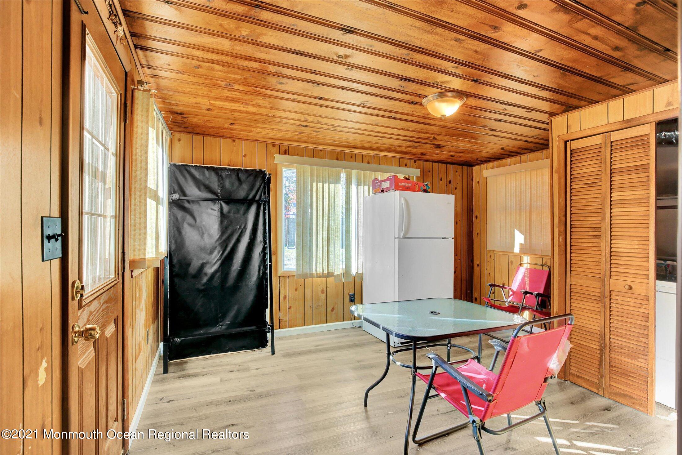 972 Woodgate Avenue Long Branch, NJ 07740 - Photo 13 of 20 a patio with table and chairs and potted plants