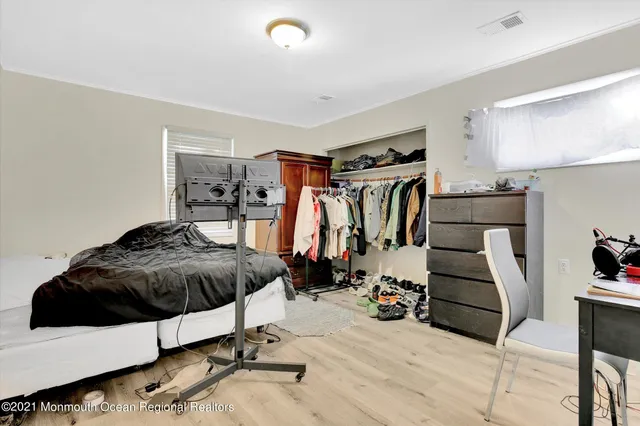 a bedroom with a bed and a walk in closet