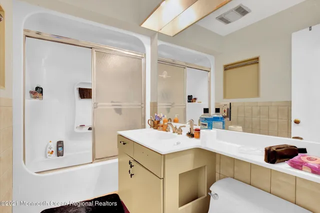 a bathroom with a sink and mirror