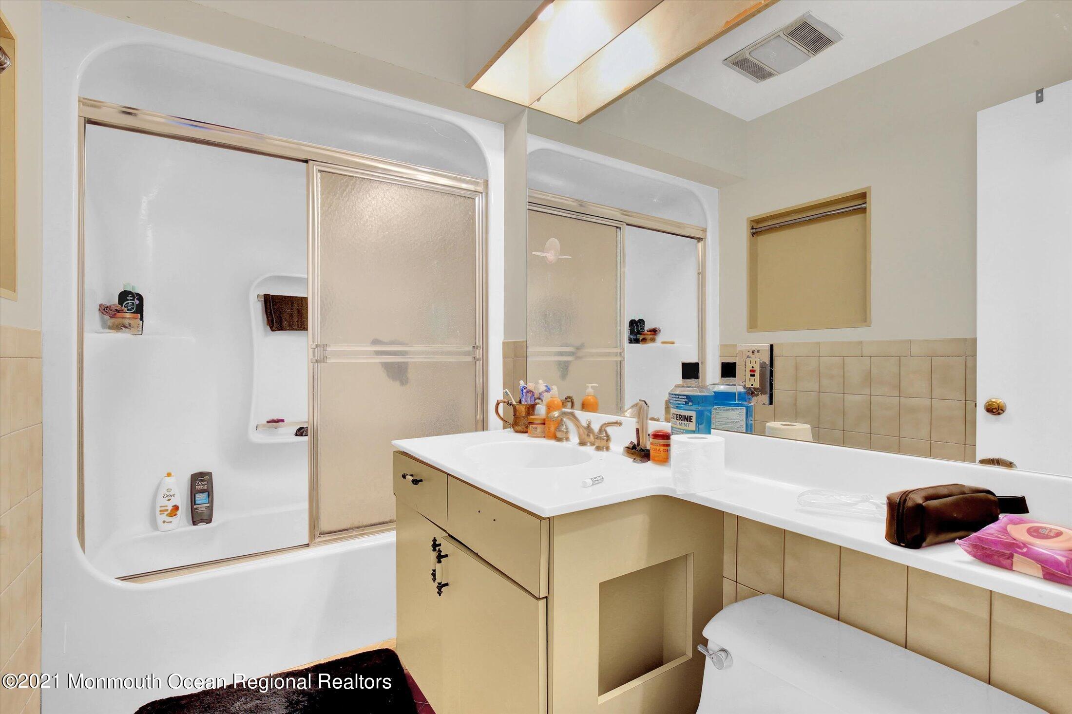 972 Woodgate Avenue Long Branch, NJ 07740 - Photo 15 of 20 a bathroom with a sink and mirror