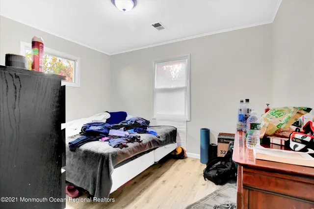 a bed room with furniture and a window