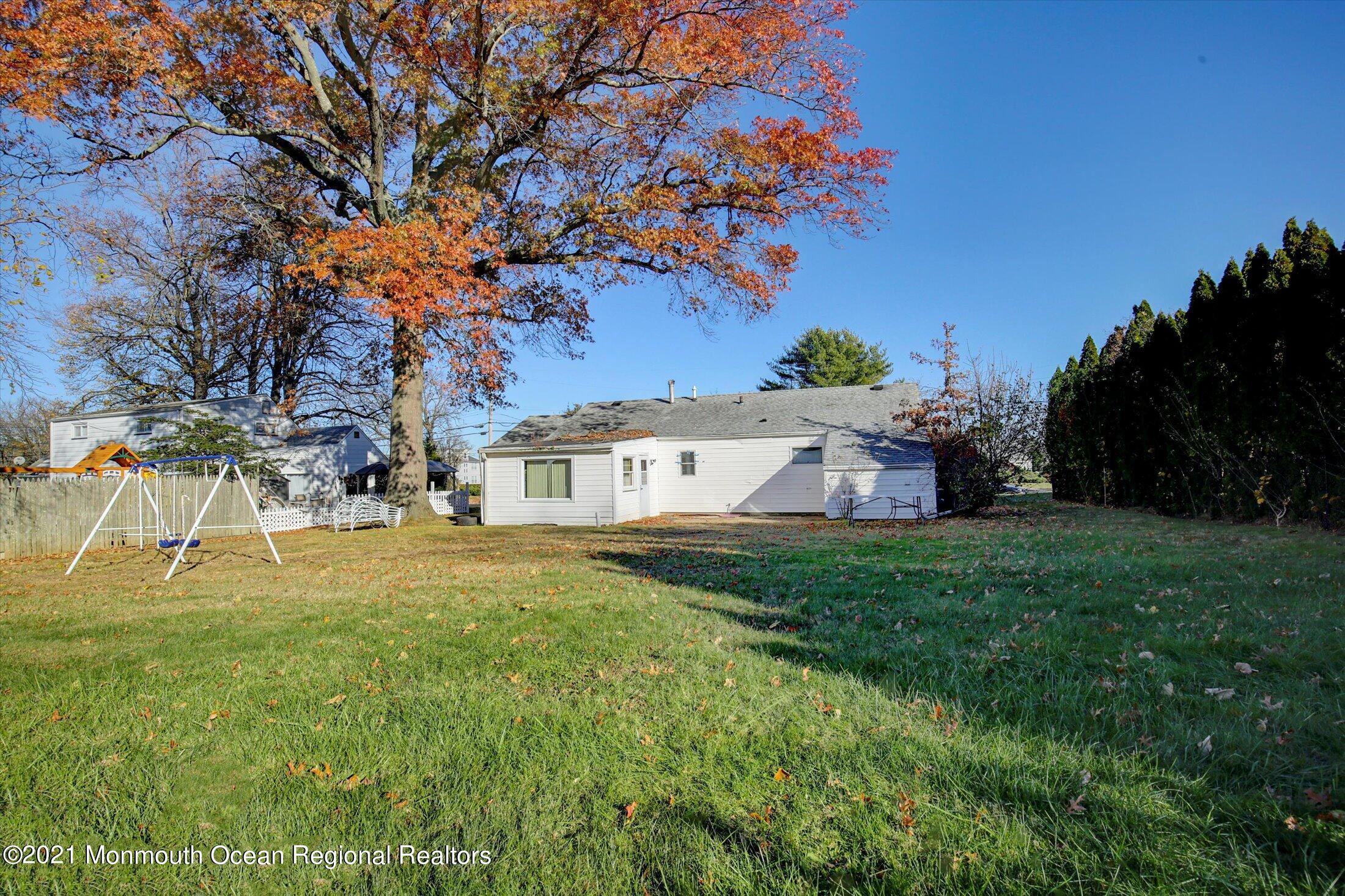972 Woodgate Avenue Long Branch, NJ 07740 - Photo 19 of 20 a view of a big house with a big yard and large trees