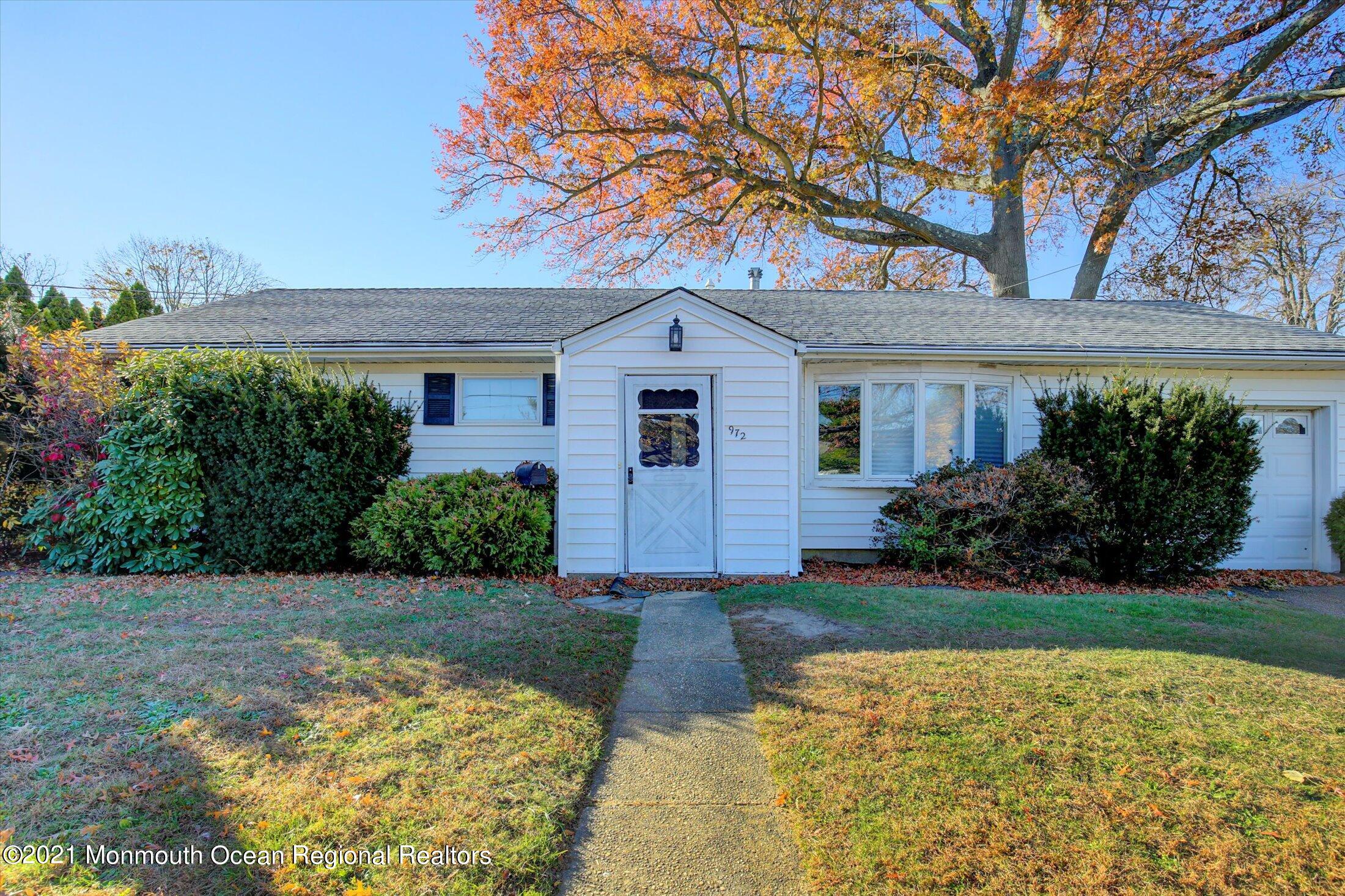 972 Woodgate Avenue Long Branch, NJ 07740 - Photo 2 of 20 a front view of a house with garden