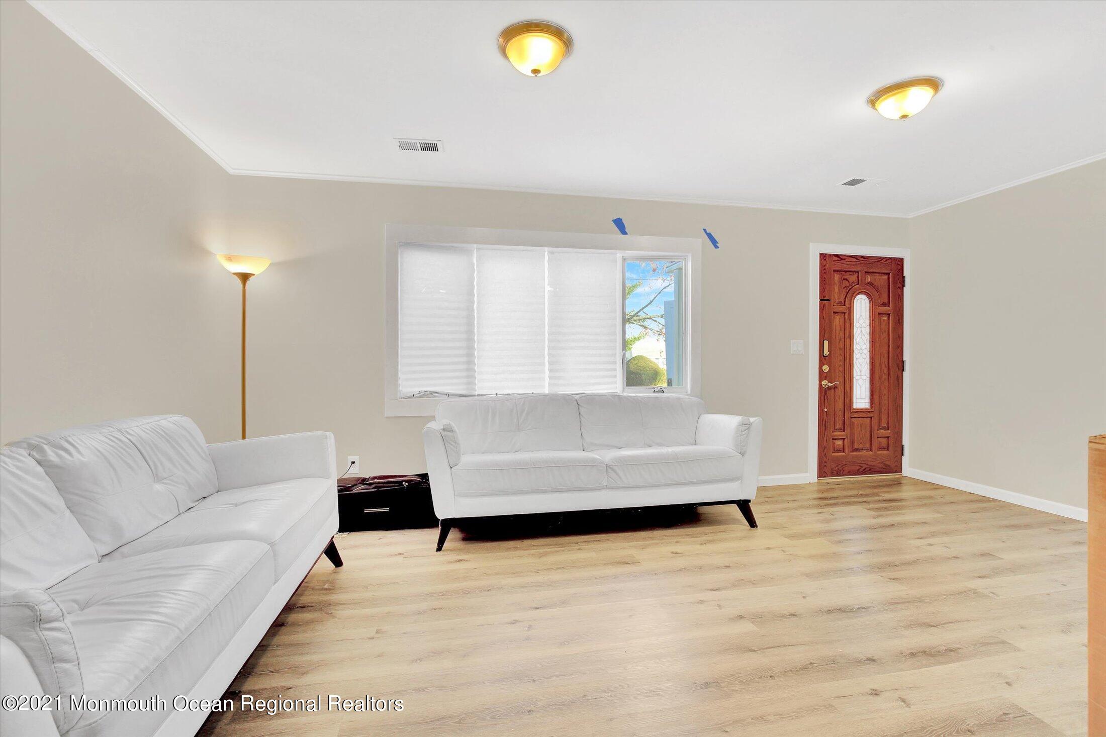 972 Woodgate Avenue Long Branch, NJ 07740 - Photo 3 of 20 a living room with furniture and a couch