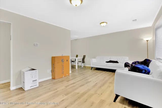 a living room with furniture and a table