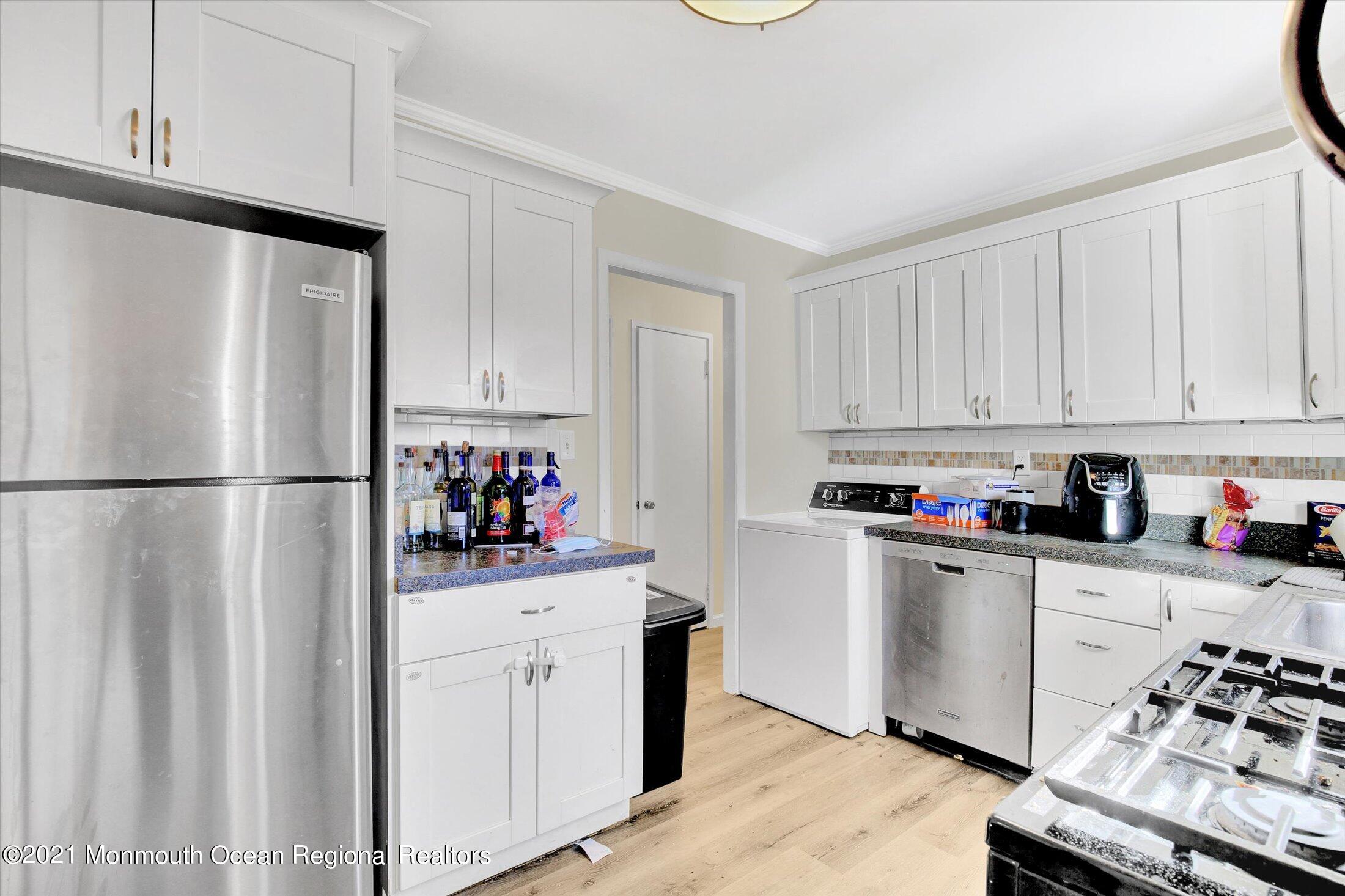 972 Woodgate Avenue Long Branch, NJ 07740 - Photo 8 of 20 a kitchen with stainless steel appliances a refrigerator sink and cabinets