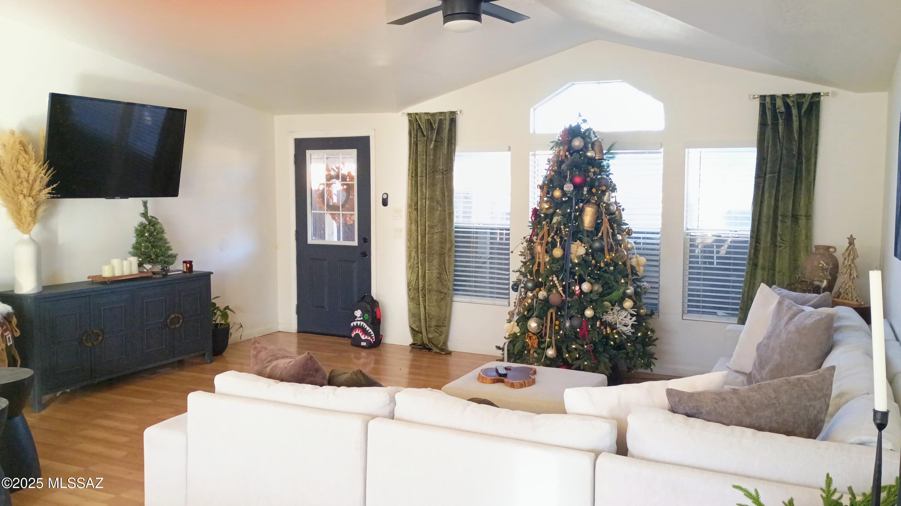 1449 West Hualpai Road Tucson, AZ 85745 - Photo 10 of 49 a living room with furniture and a flat screen tv