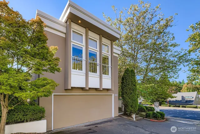 a front view of a building with a yard