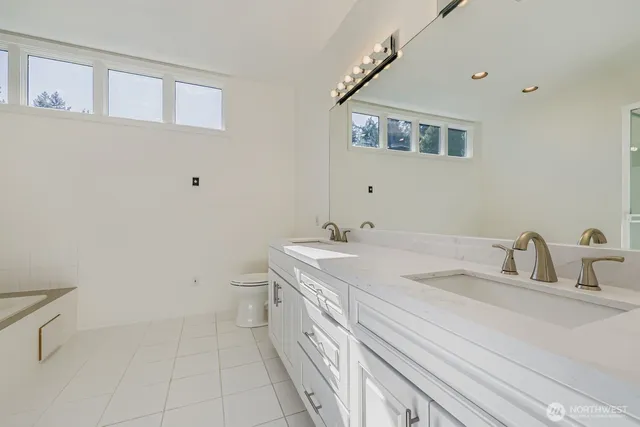 a bathroom with a sink a vanity and a mirror
