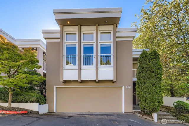 a front view of a house with a garage
