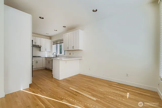 a view of kitchen with wooden floor