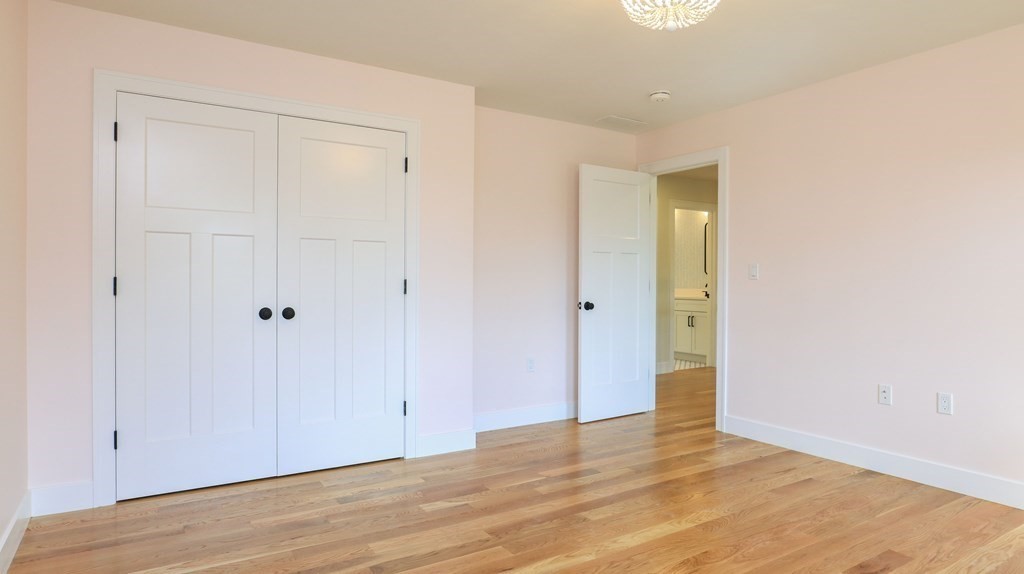 340 Longley Road Groton, MA 01450 - Photo 15 of 20 a view of an empty room with wooden floor