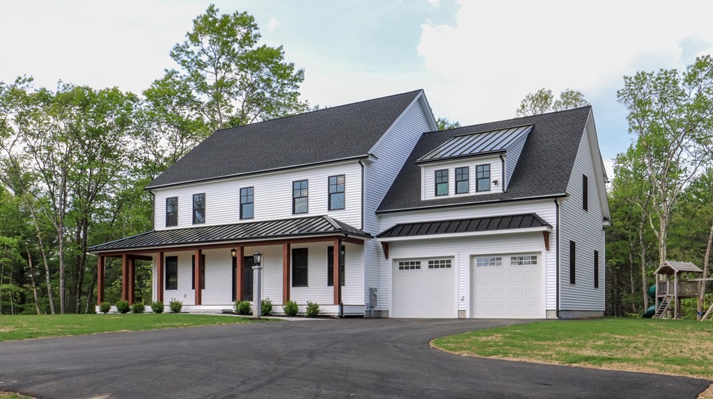 340 Longley Road Groton, MA 01450 - Photo 16 of 20 a front view of a house with a garden