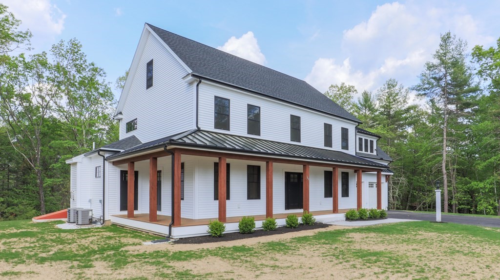 340 Longley Road Groton, MA 01450 - Photo 18 of 20 a front view of a house with a yard