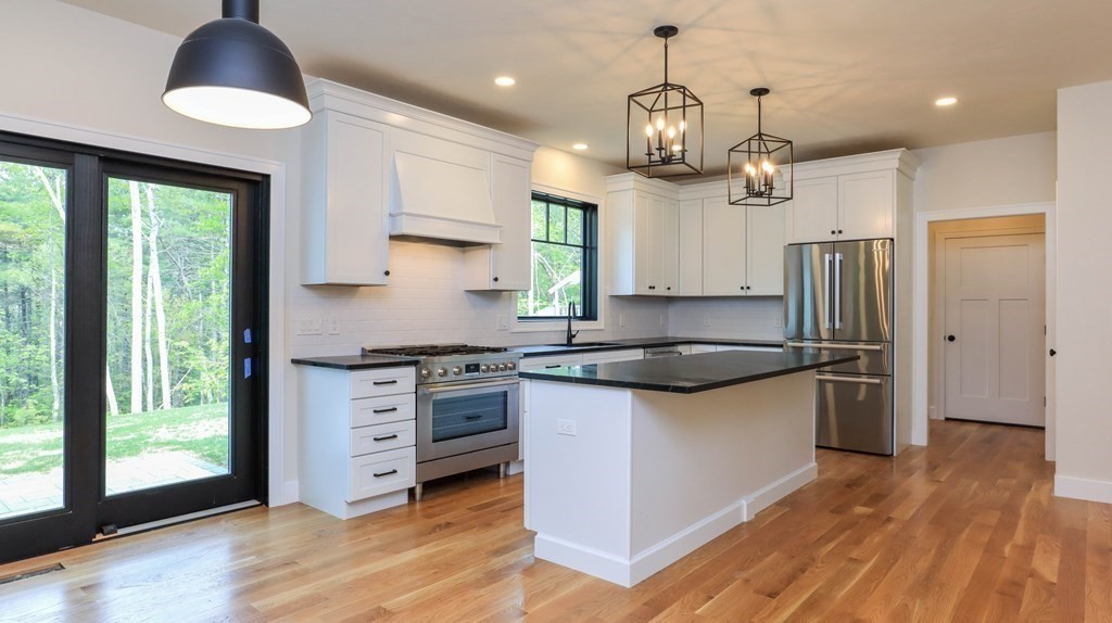 340 Longley Road Groton, MA 01450 - Photo 2 of 20 a kitchen with stainless steel appliances granite countertop a stove a sink and a refrigerator