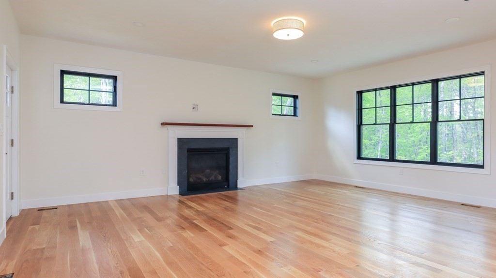 340 Longley Road Groton, MA 01450 - Photo 7 of 20 a view of empty room with wooden floor and fan