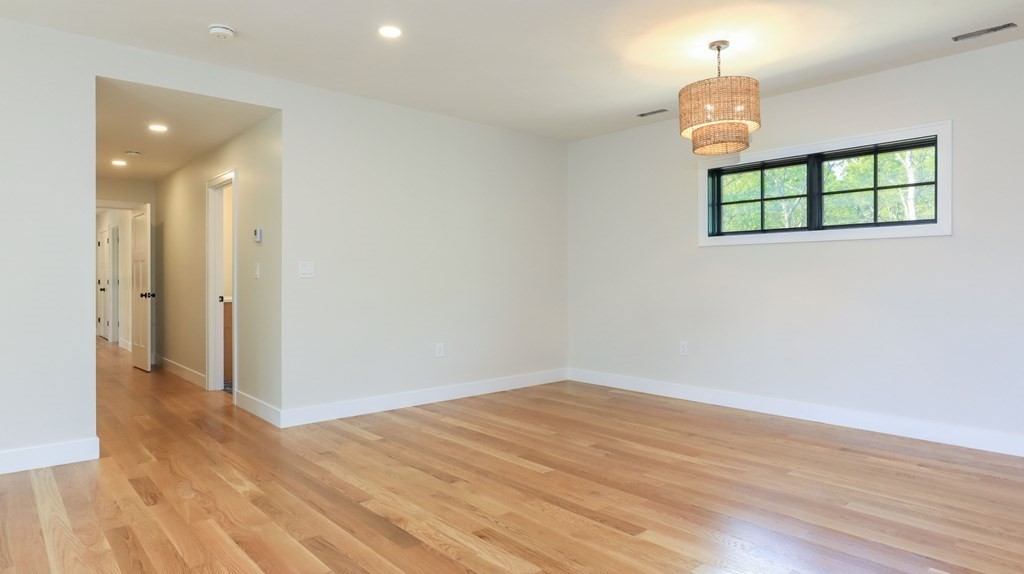 340 Longley Road Groton, MA 01450 - Photo 9 of 20 wooden floor in an empty room with a window