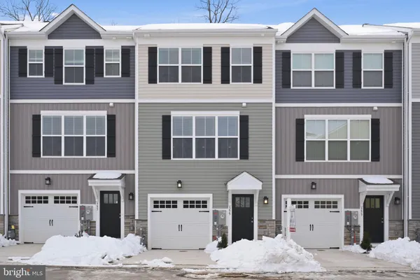 a front view of a building with many windows