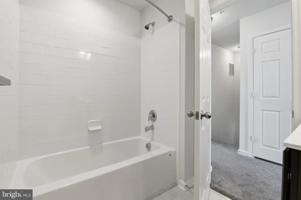 a view of a hallway with washer and dryer
