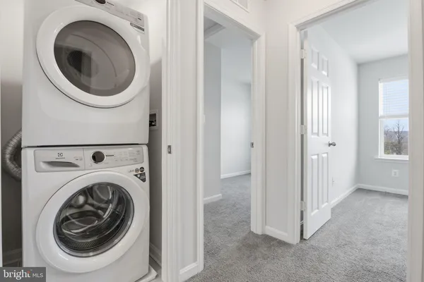 a view of a hallway with staircase