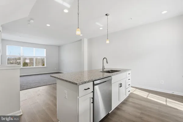 a kitchen with sink and window