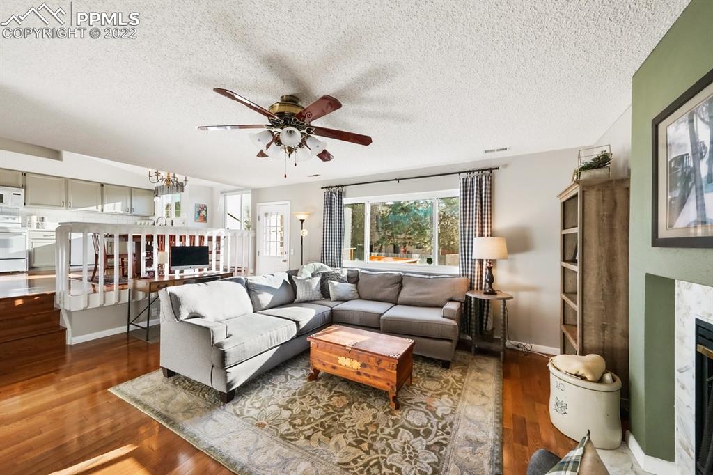 5145 Slickrock Drive Colorado Springs, CO 80923 - Photo 15 of 33 a living room with furniture and a large window