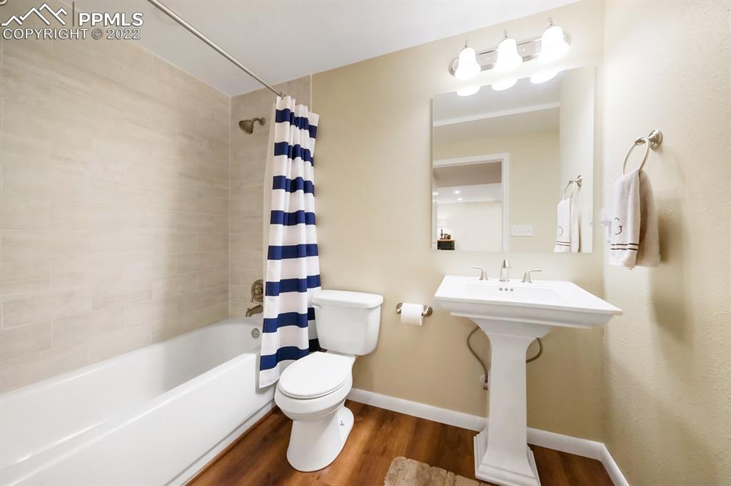 5145 Slickrock Drive Colorado Springs, CO 80923 - Photo 25 of 33 a bathroom with a sink toilet and shower